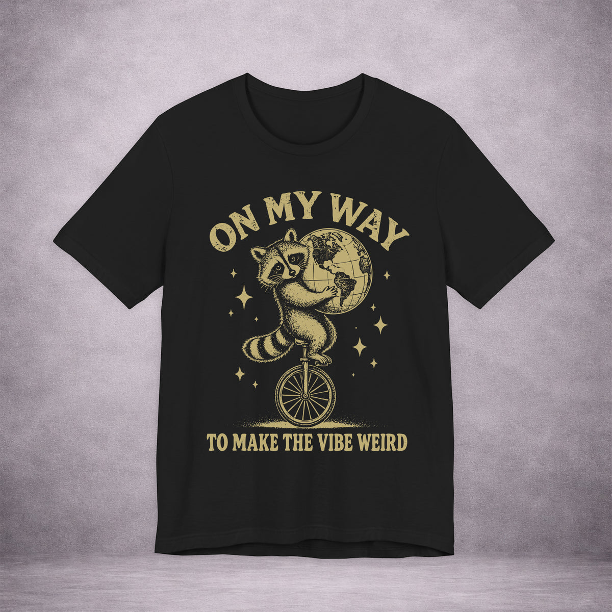 RACCOON-ON-ONE-WHEEL-0C114A-PREMIUM-JERSEY-TEE-BLACK-FRONT-INK-GOLD-01